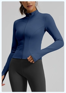 Detail of navy yoga jacket featuring thumbhole cuffs and ergonomic slimming seams