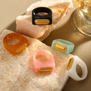 French style colorful resin square rings with gold inlay displayed on stone