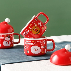 Christmas ceramic mug set with Santa and reindeer patterns and festive hat lids