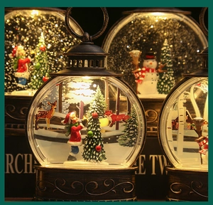 Close-up of vintage bronze Christmas lanterns with Santa and snowman scenes inside