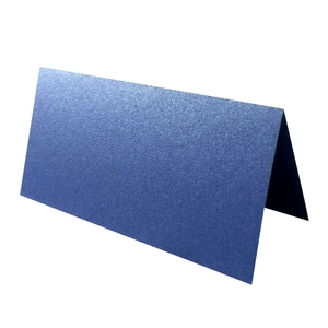 Detail of royal blue pearlescent folding place card with elegant paper texture