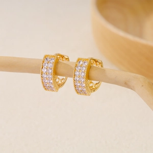 Gold-plated copper hoop earrings with double row cubic zirconia and heart cutouts