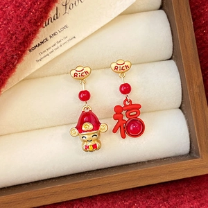 Asymmetric God of Wealth and Fu earrings in red and gold with Rich gold ingot details