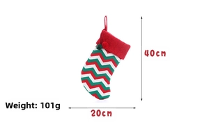 Close-up of knit Christmas stocking with pom-poms, dimensions 40cm height and 20cm width