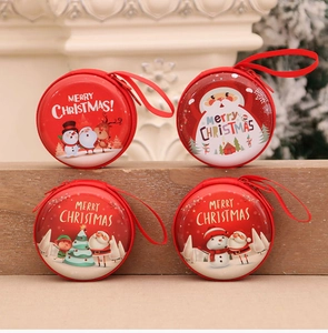 Set of four red round Christmas coin purses with Santa and reindeer illustrations