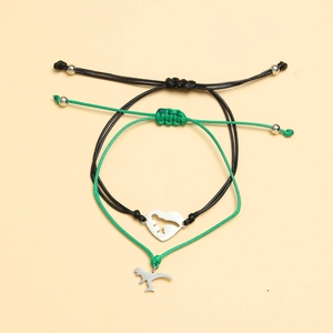 Adjustable dinosaur couple bracelets set with heart cutout charm on woven ropes