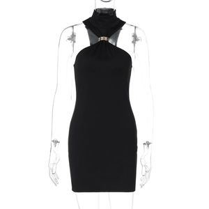 Detail of black halter dress featuring a golden metal ring at the neckline