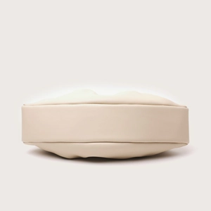 Detailed bottom view of beige pleated evening bag showing oval structure and stitching