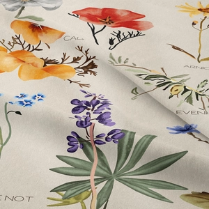Close-up of bohemian floral tapestry fabric showing linen texture and vibrant botanical prints