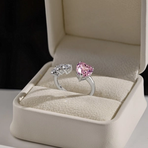 Macro view of a luxury S925 sterling silver ring with a pink heart-shaped carbon diamond