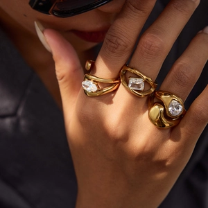 Three-piece gold stainless steel ring set with pear, emerald, and marquise zircon stones