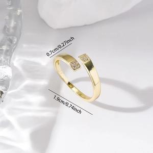 Detailed view of adjustable gold ring with square zircon and size measurements