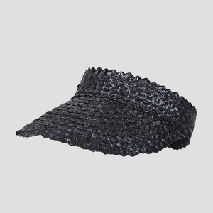 Detailed view of black wheat straw visor featuring unique hand-woven scale patterns