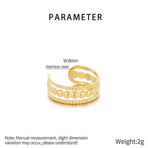 Detail view of 8mm wide stainless steel gold ring with layered beads and textured band