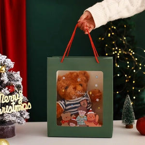 Christmas hollow gift bag with a cute brown plush teddy bear wearing a blue striped sweater