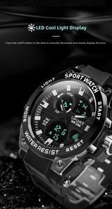 Detail of dual-display waterproof sports watch with LED backlight on black textured surface