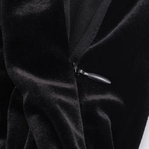 Detailed macro view of high-quality black velvet fabric with a smooth invisible zipper