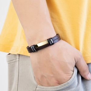 Men's minimalist braided dark brown leather bracelet with gold and black metal buckle