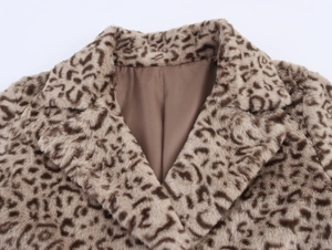 Detailed view of leopard print faux fur coat collar showing plush texture and brown lining