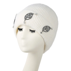 White knitted beanie for women featuring leaf-shaped rhinestone accents on white model