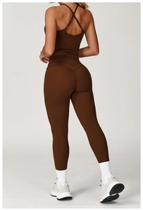 Detailed view of dark brown criss-cross back yoga vest and matching high waist leggings