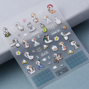 Macro detail of 5D embossed nail stickers featuring cute cartoon ducks with tactile texture