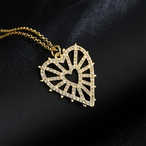Elegant 18K gold plated hollow heart necklace with sparkling zircon eye pendant