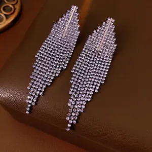 Elegant silver tassel drop earrings with sparkling purple crystals for formal occasions