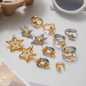 Star-patterned stainless steel jewelry set including gold and silver rings and earrings