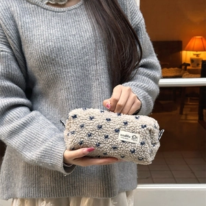 Winter plush cream pencil case with blue heart patterns and soft fleece texture