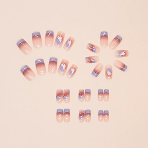 Close-up of lavender French tip press-on nails with purple gradients and cloud patterns