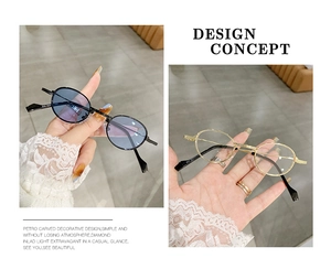 Detail view of oval retro sunglasses showing metal frame and hinge construction