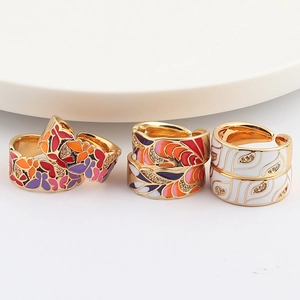 Three vintage adjustable rings with colorful enamel designs and zircon micro-inlays