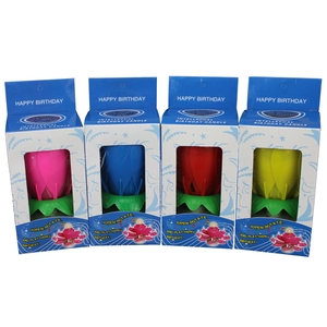 Set of four rotating musical lotus flower birthday candles in pink, blue, red, and yellow