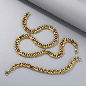 Close-up of golden stainless steel cuban curb chain set with lobster clasp for men