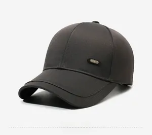 Detail view of charcoal grey baseball cap showing 6-panel crown and metal sport emblem