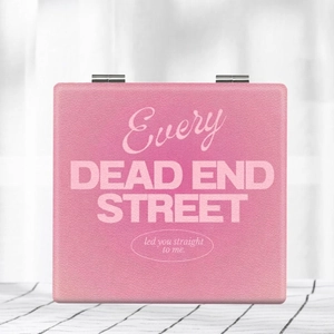 Pink faux leather foldable mirror with white aesthetic typography and metal hinges
