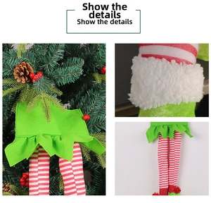 Detailed view of striped Christmas elf leg hanging ornament with soft faux fur trim decor