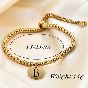 Detail of 18K gold plated beaded bracelet with letter B charm, 18-25cm size and 14g weight