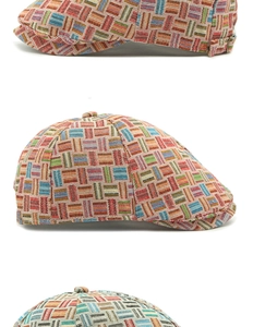 Close-up of geometric woven fabric and metal buckle detail on retro beret hat