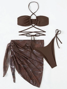 Detailed flat lay of brown marble print mesh sarong and three-piece bikini set
