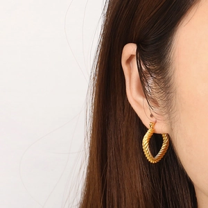 Detailed view of vintage 18K gold plated geometric cable twist square hoop earrings