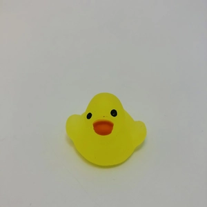 Detailed view of a classic yellow rubber duck bath toy with orange beak for children