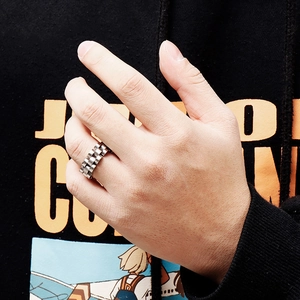 Minimalist silver stainless steel watch link chain ring worn on finger in streetwear style