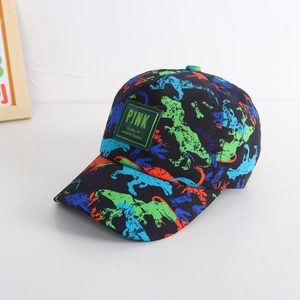 Detail of kids baseball cap featuring colorful dinosaur prints and a green woven label