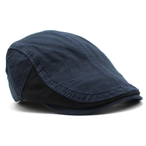 Detail of navy and black contrast stitching on a vintage cotton flat cap for men