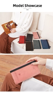 Detail of travel passport wallet showing elastic strap closure and interior card slots