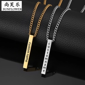 Macro detail of custom name engraving on gold and silver polished bar pendant necklaces