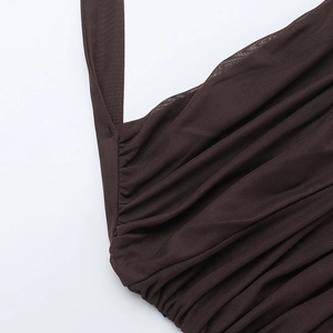 Close-up of brown mesh dress detail featuring halter straps and delicate ruched pleated texture