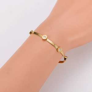 Gold-plated flat snake chain bracelet with sparkling Roman numeral zircon charms